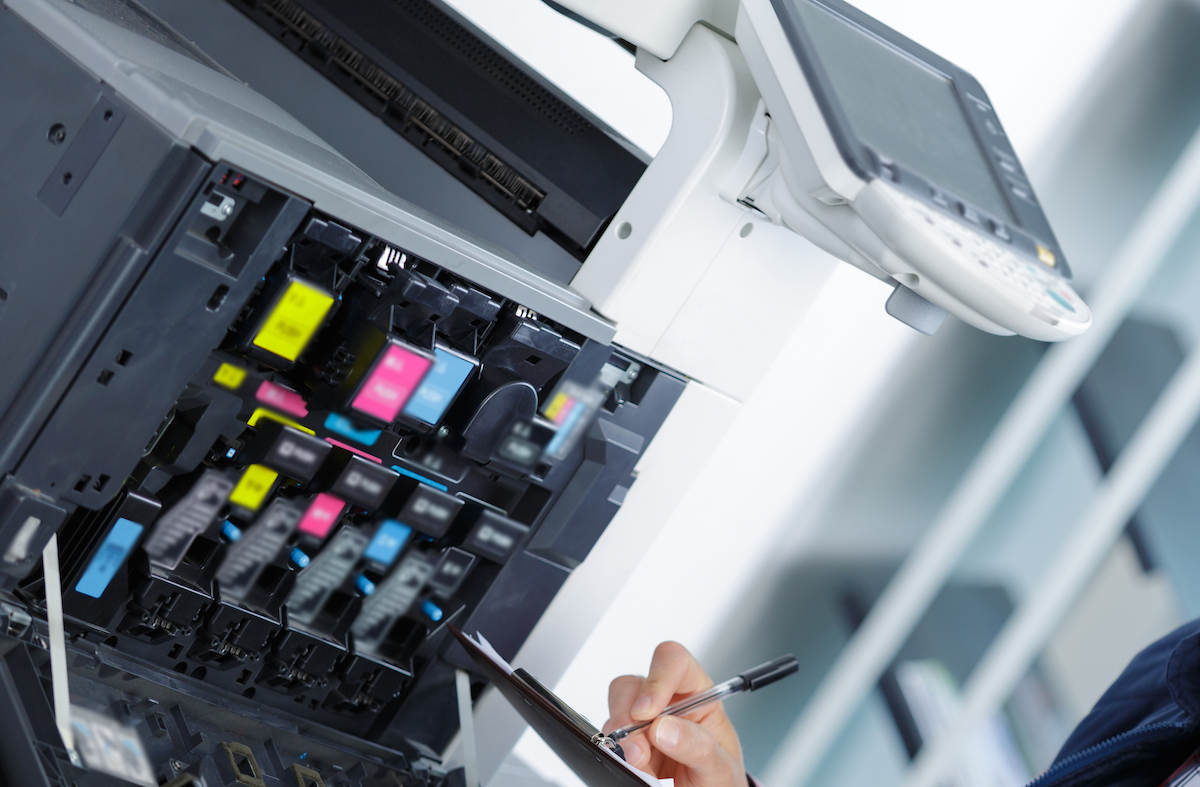 handyman fixing the office printer